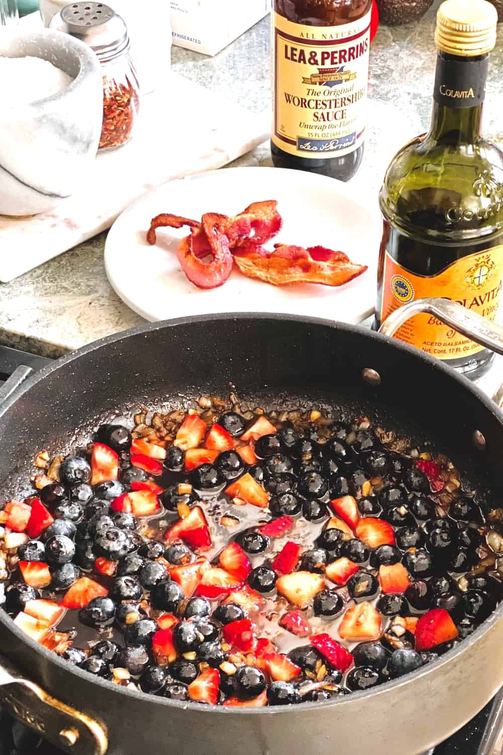 berry sauce with bacon on a plate