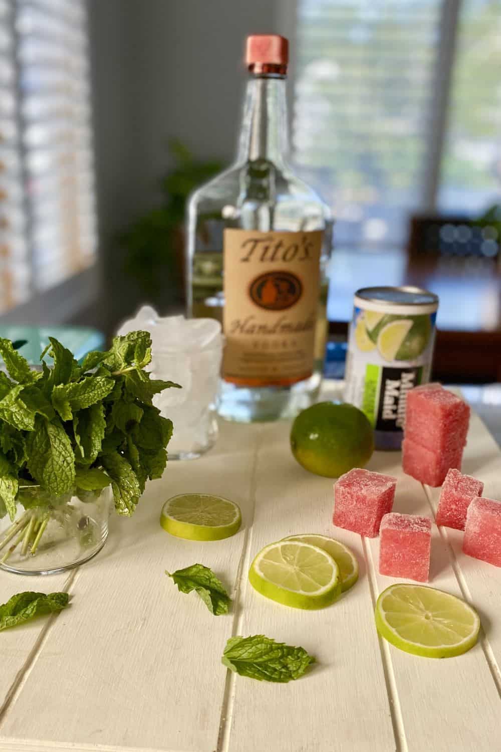 vodka, limeade concentrate, mint, lime and ice cubes