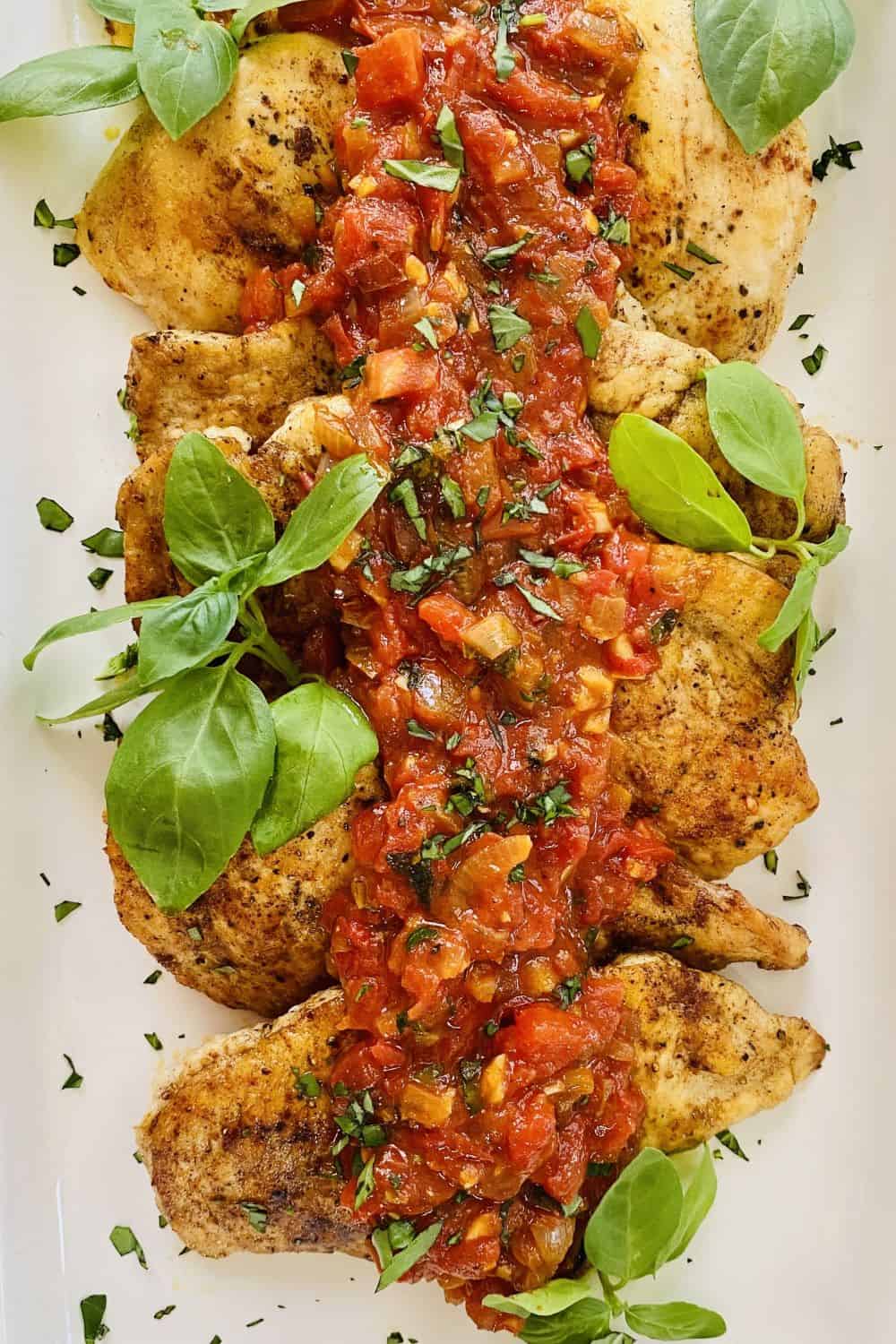butter sauteed chicken topped with sauce