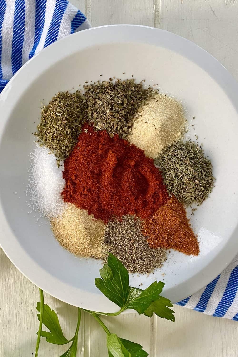 Paprika, thyme, basil, oregano, onion powder, garlic powder, cayenne pepper and pepper.