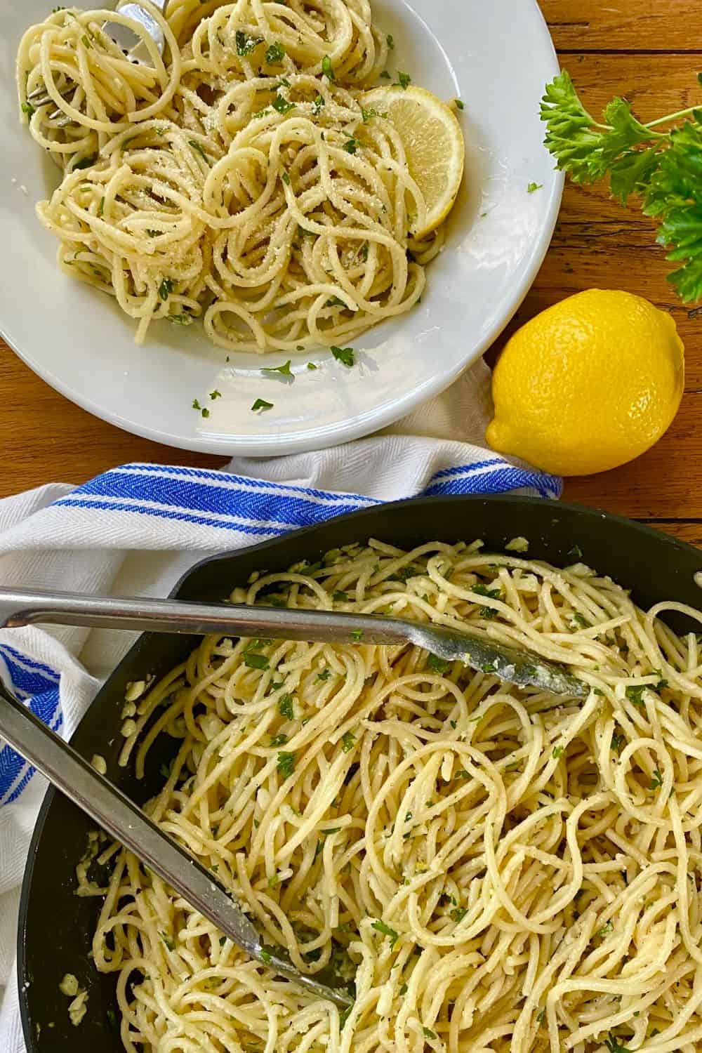 a saute pan and a serving of buttered noodles with Parmesan