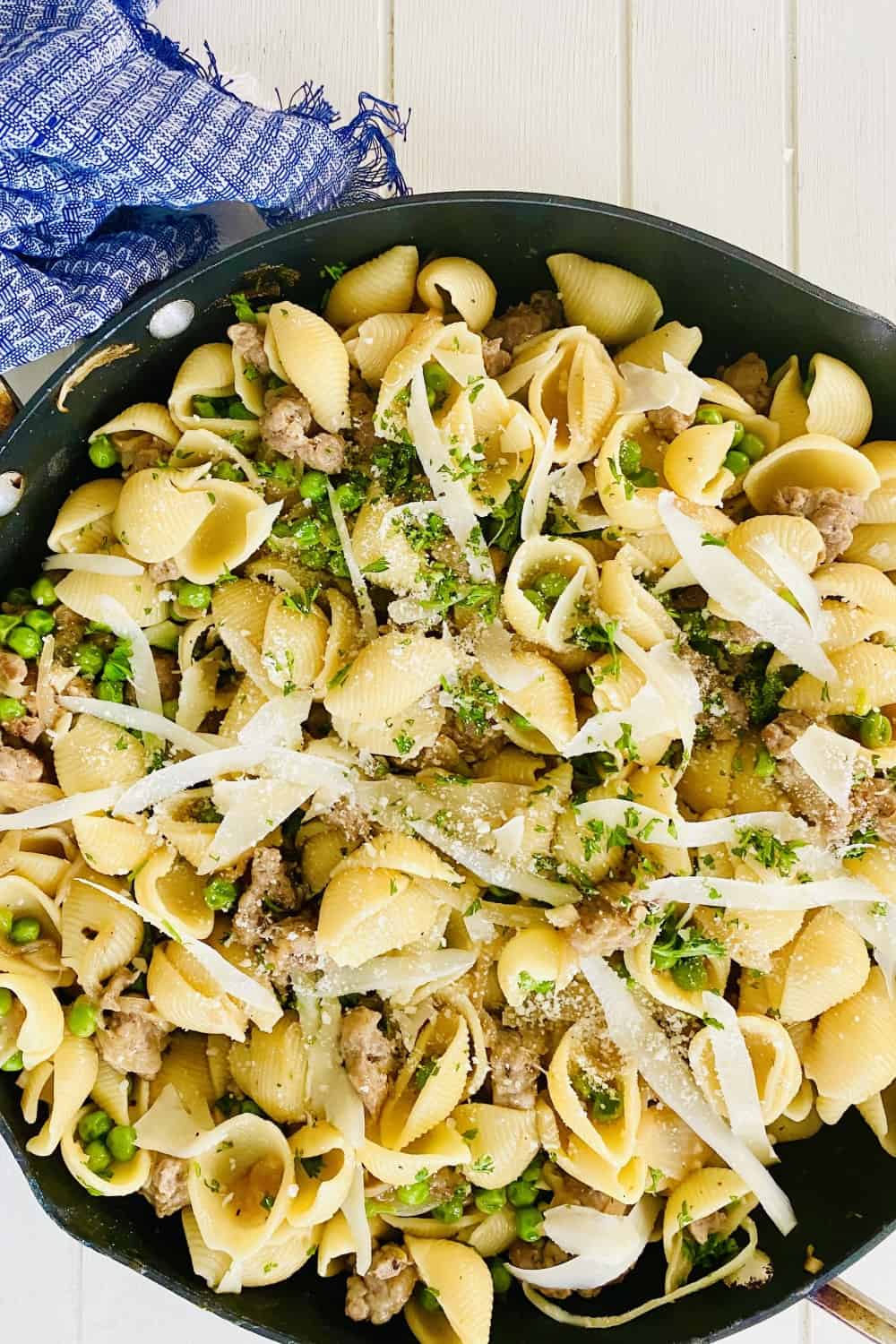 A big skillet of shells and Italian sausage.