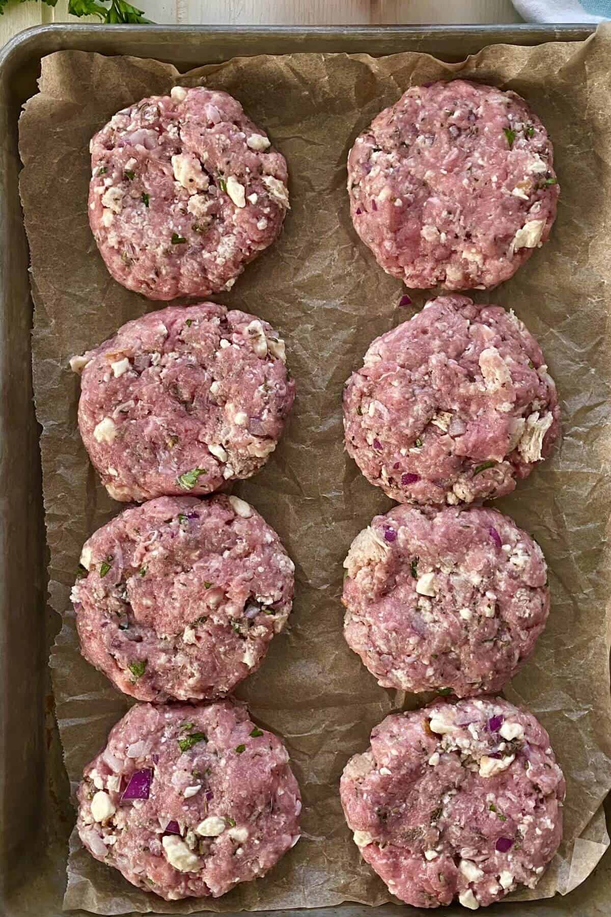 uncooked Greek turkey burgers.