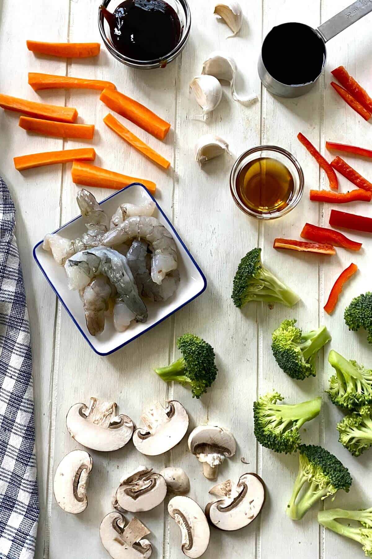 shrimp, carrots, mushrooms, red pepper, broccoli, sesame oil, soy sauce.