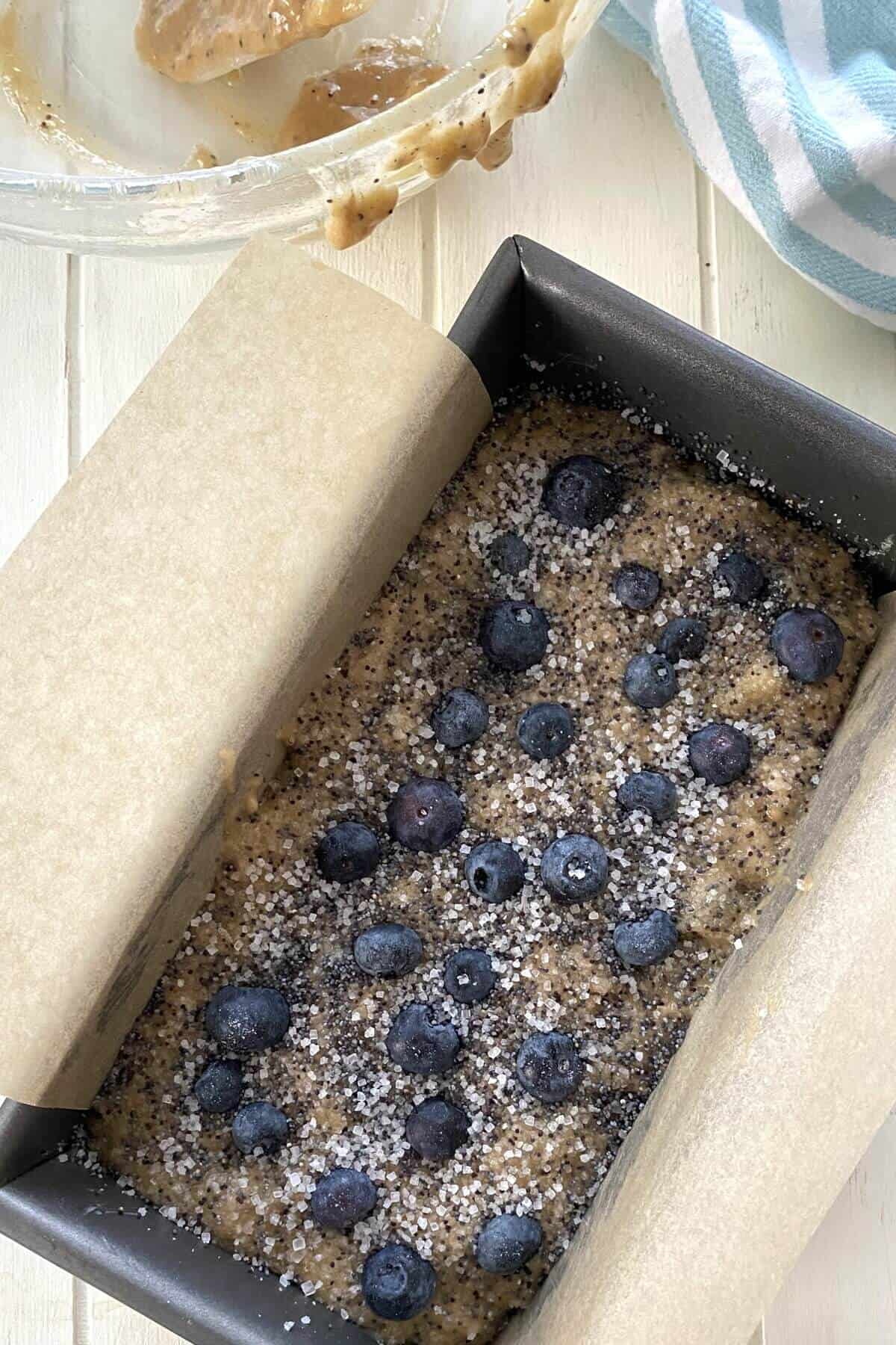 Banana bread batter in a loaf pan.