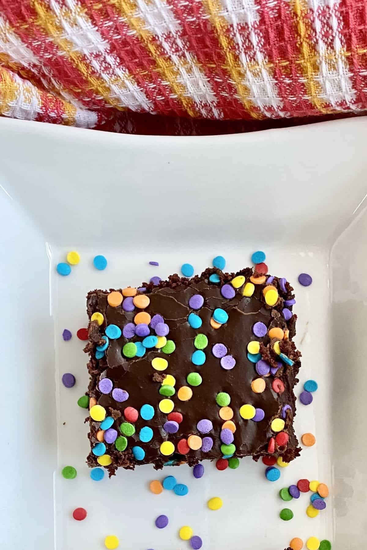 a slice of chocolate dessert with sprinkles.