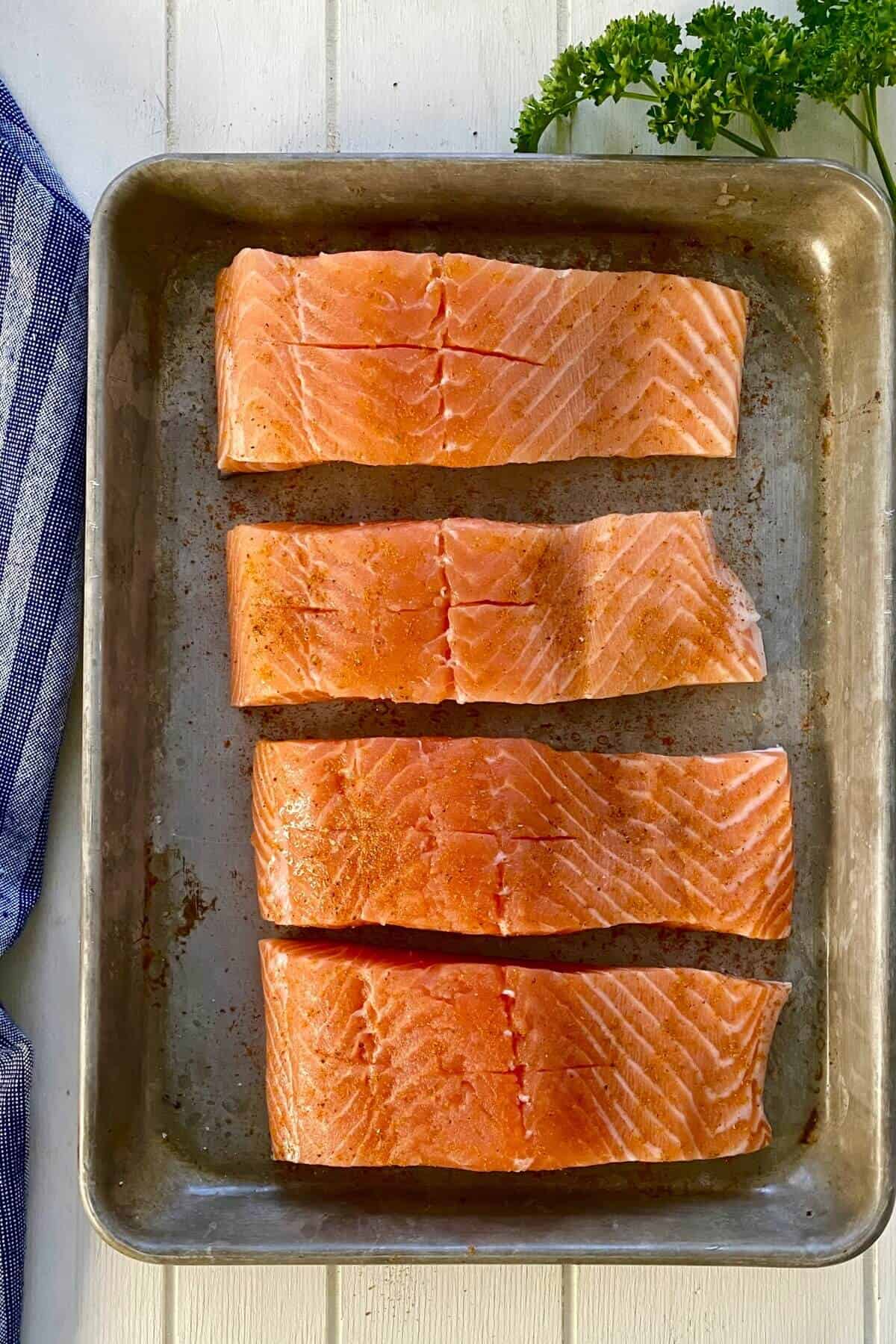 4 salmon fillets with pockets cut in them.