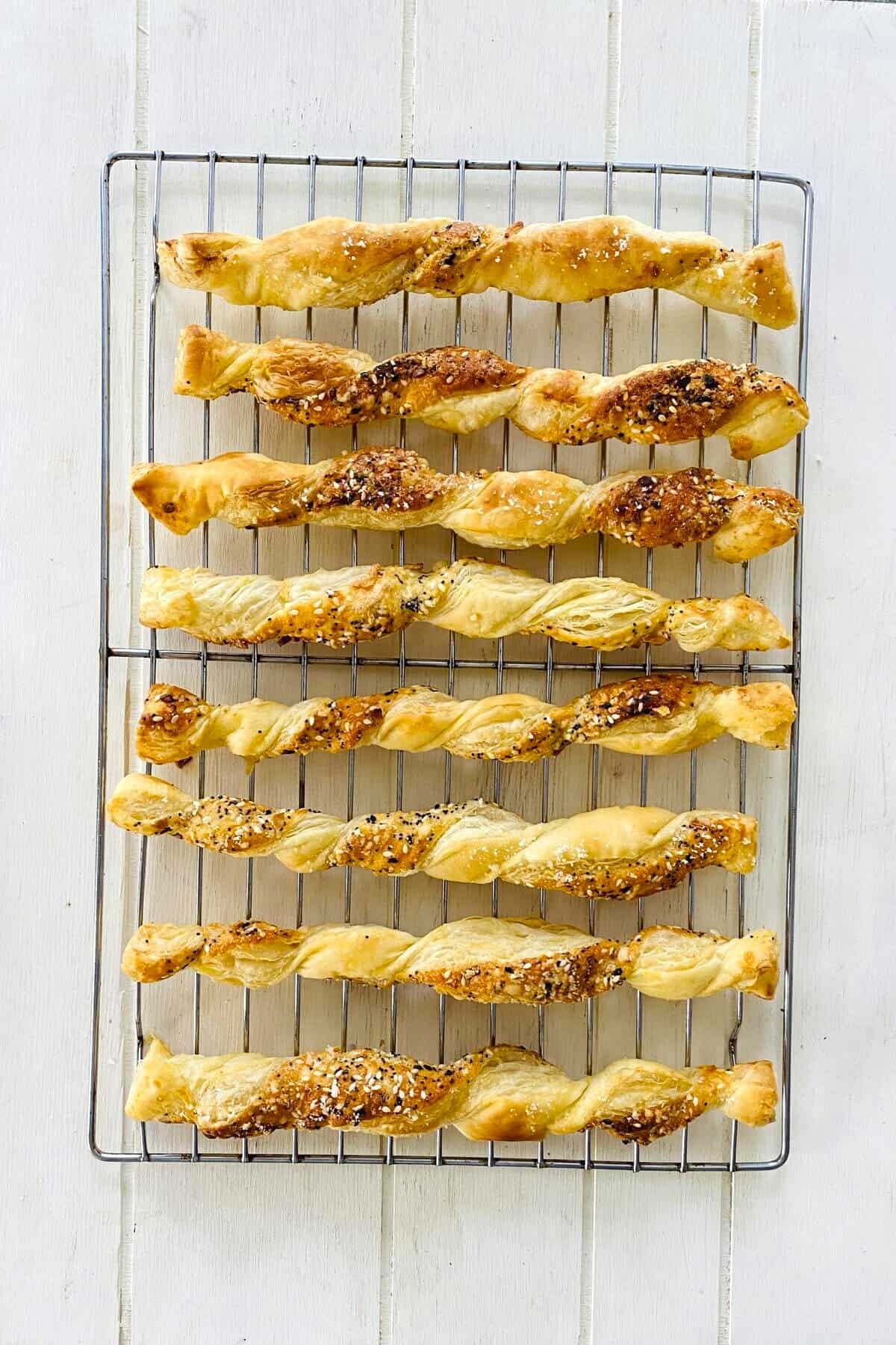 cheese twists on cooling rack.