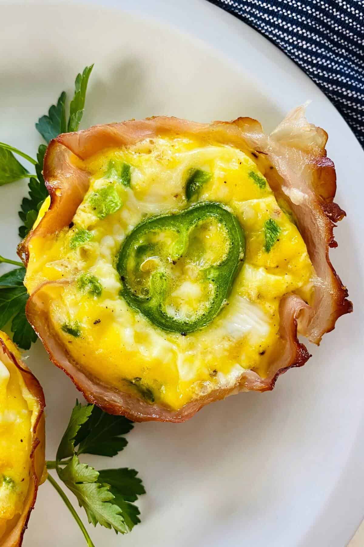a single jalapeno popper egg cup on a plate.
