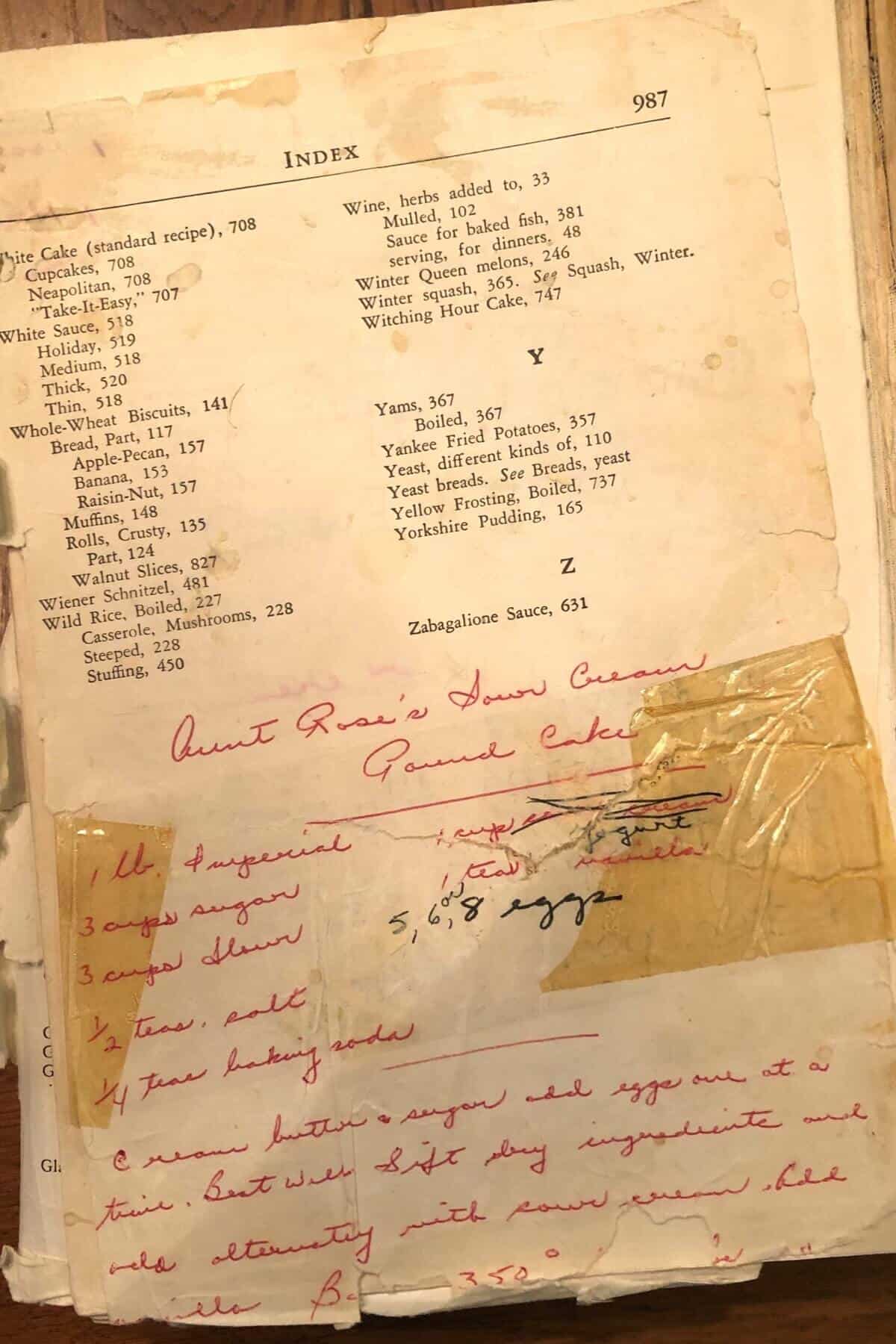 old Joy of Cooking cookbook with hand written old fashioned sour cream pound cake recipe.