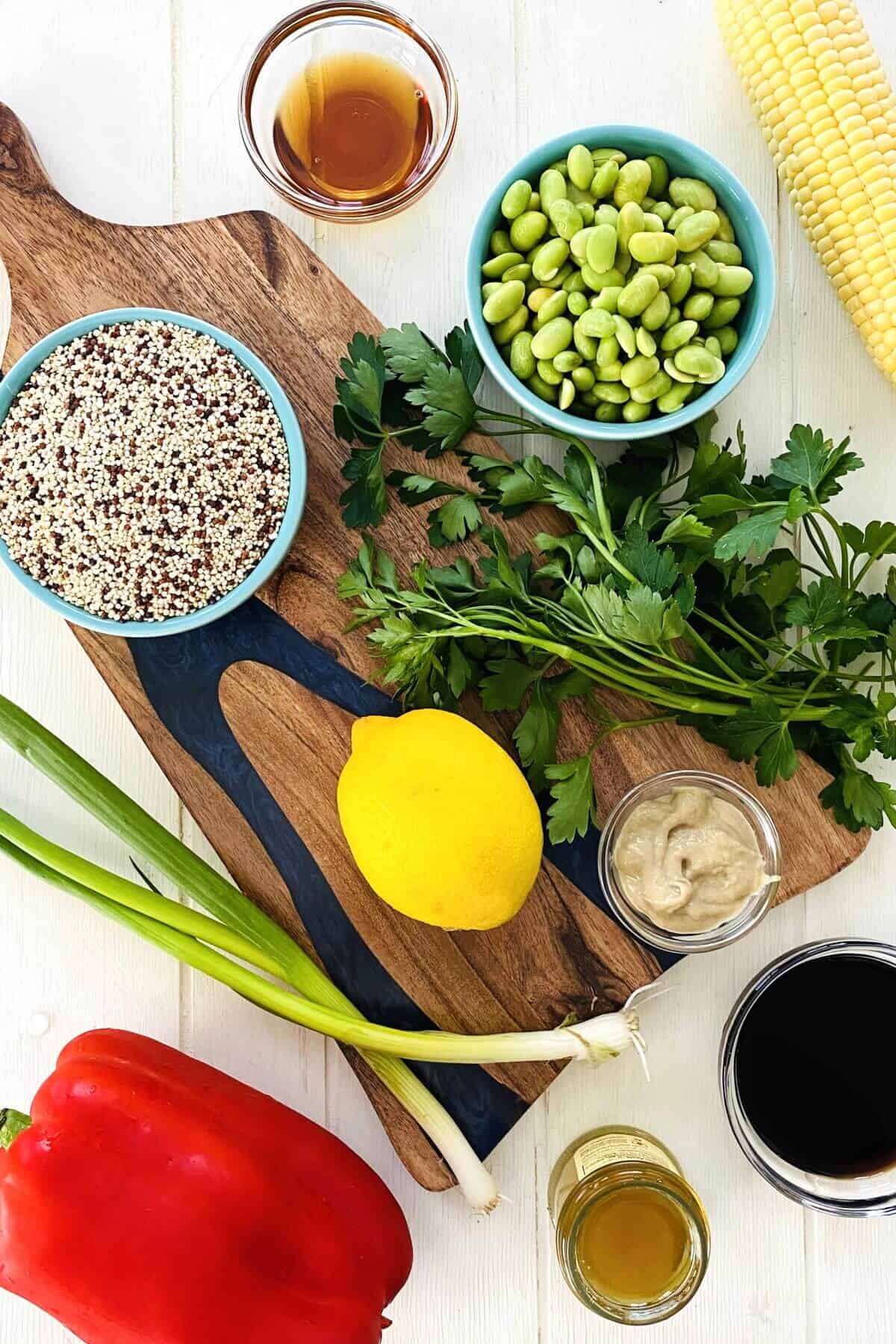 quinoa, edamame, lemon, red pepper, corn on the cob, soy sauce, sesame oil.