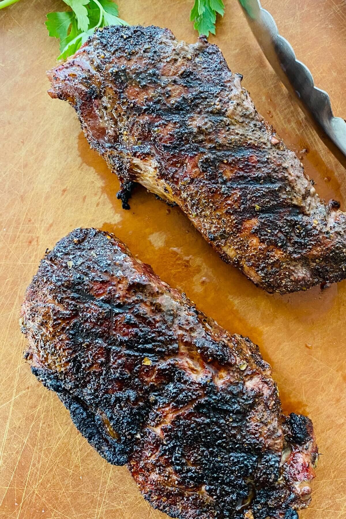 2 grilled New York strip steaks.