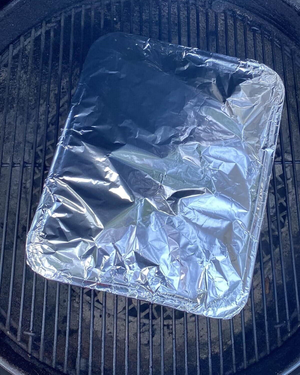 covered foil pan on grill.