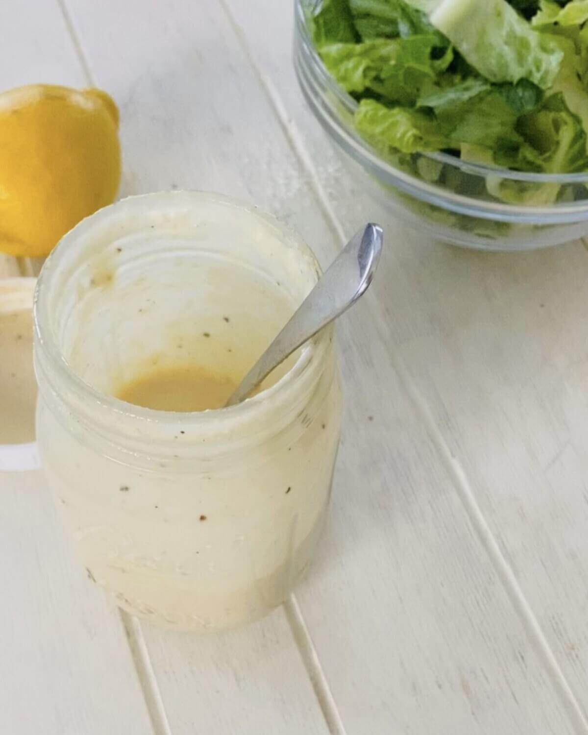 open jar of Caesar dressing.