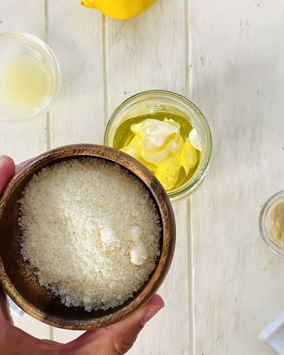adding Parmesan cheese to mason jar.