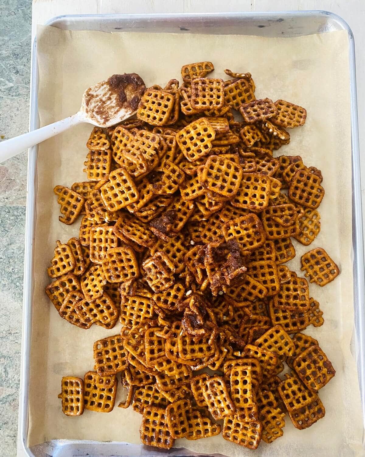 pretzels on a baking sheet with pumpkin spice.