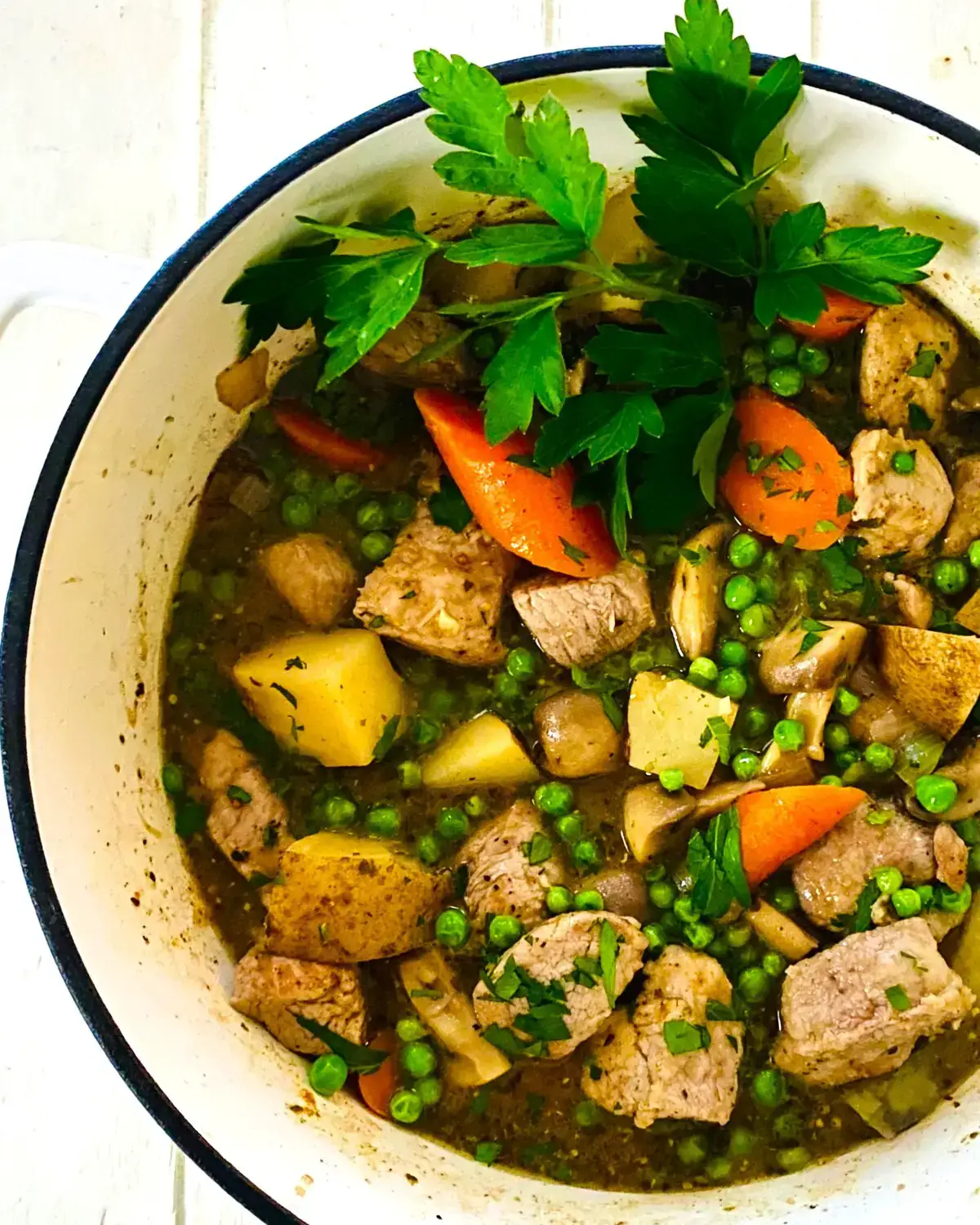 A pork stew in a Dutch oven.