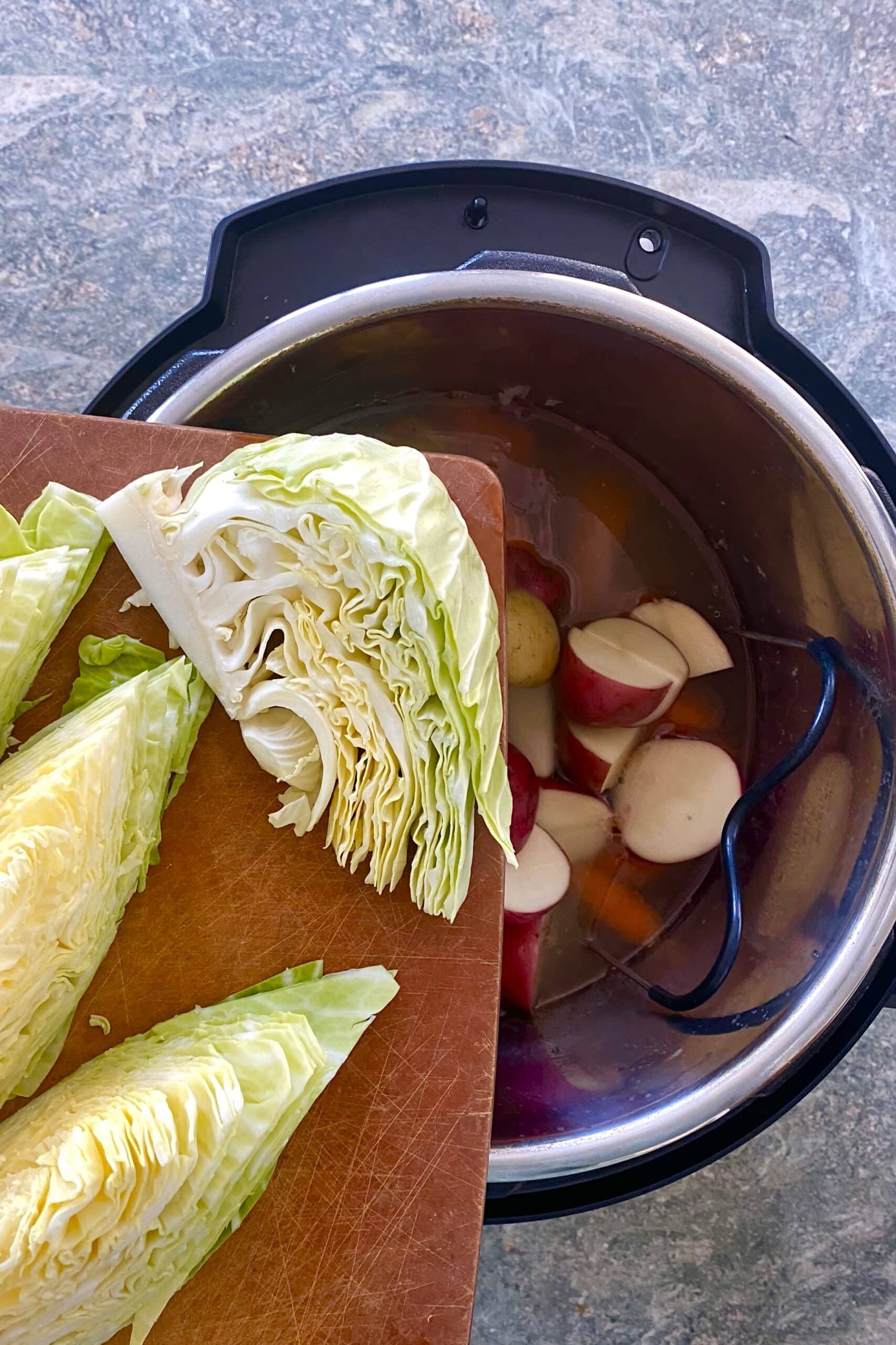adding cabbage wedges to Instant Pot for corned beef.