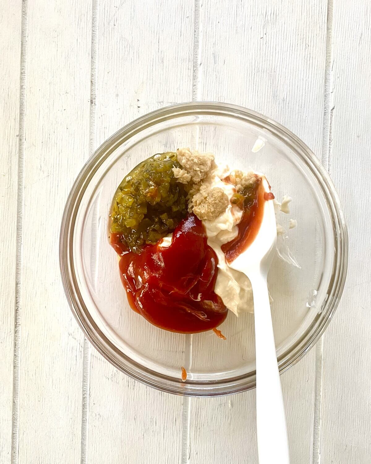 mayo, ketchup, pickle relish, horseradish in a bowl.
