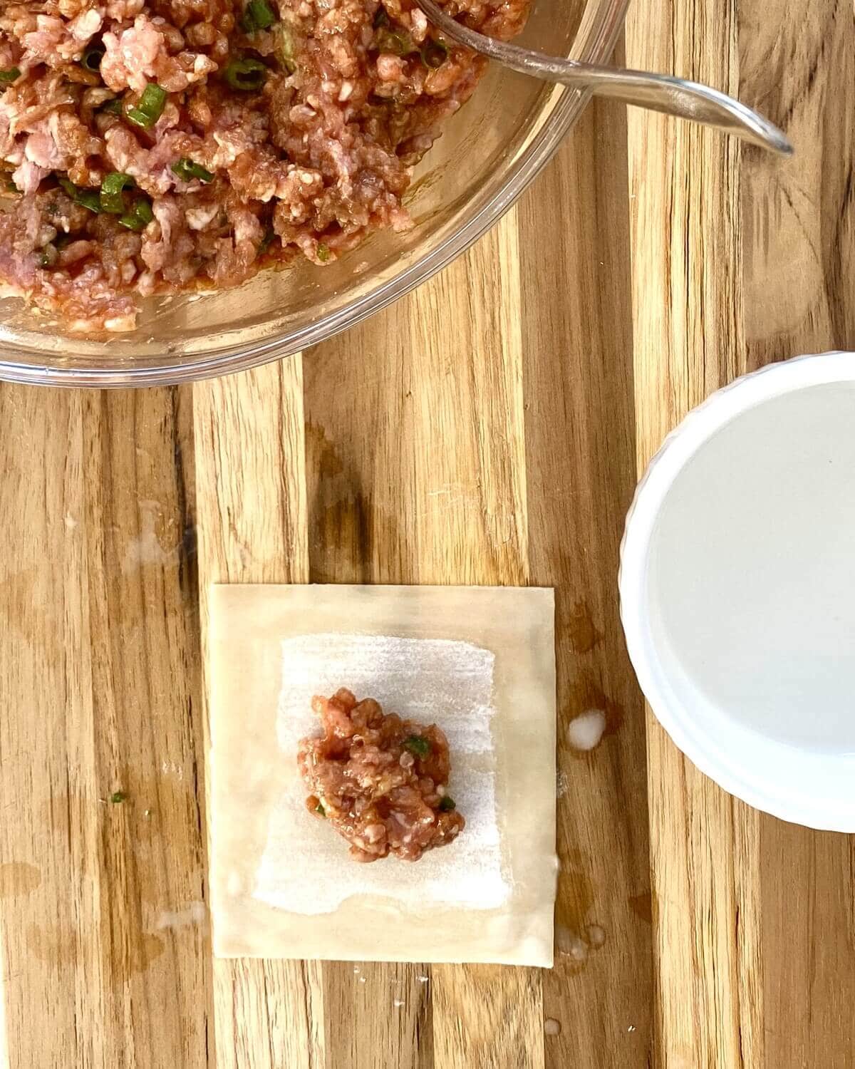 Filling potstickers.