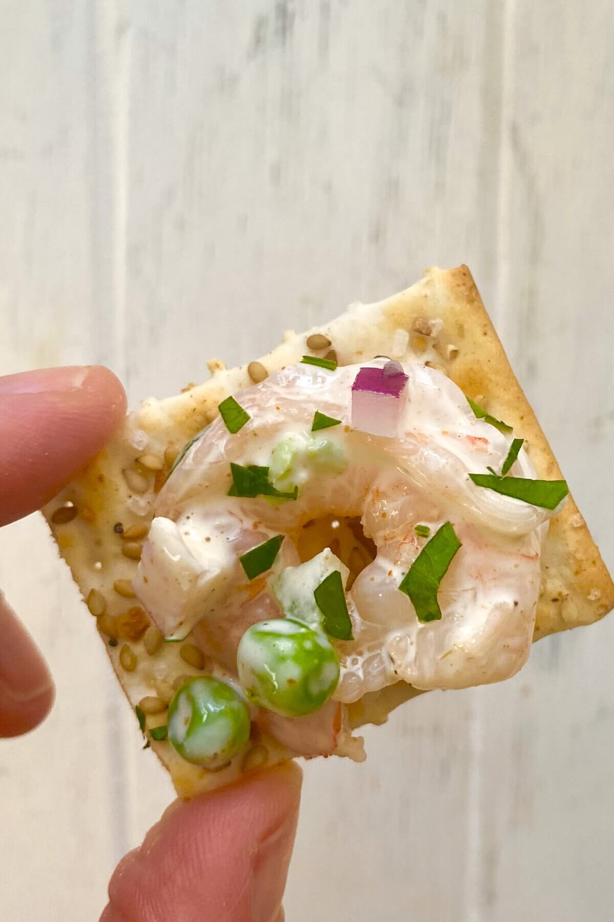 shrimp salad on a cracker.