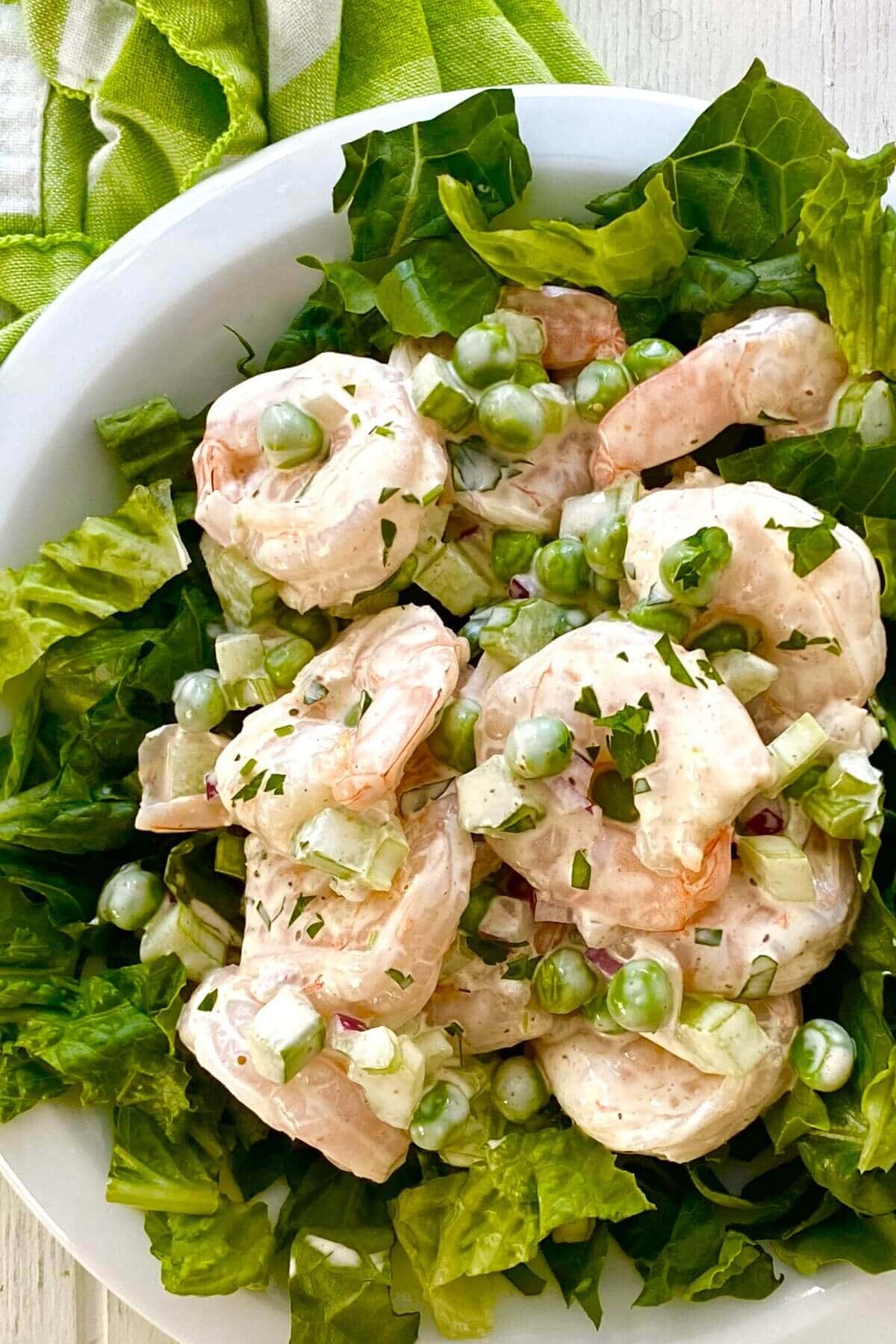 shrimp salad on a bed of lettuce.
