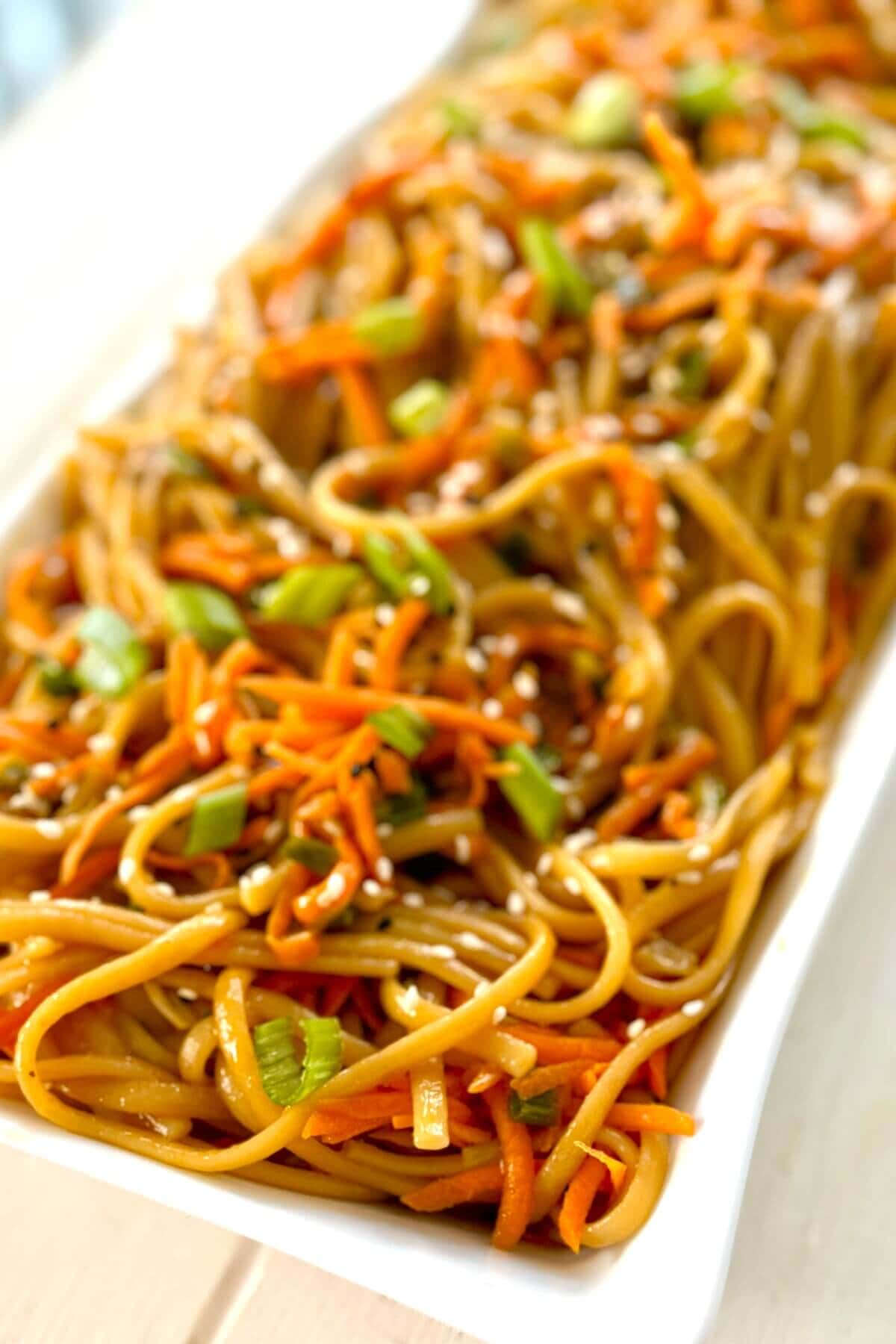 large serving dish with Asian noodles.