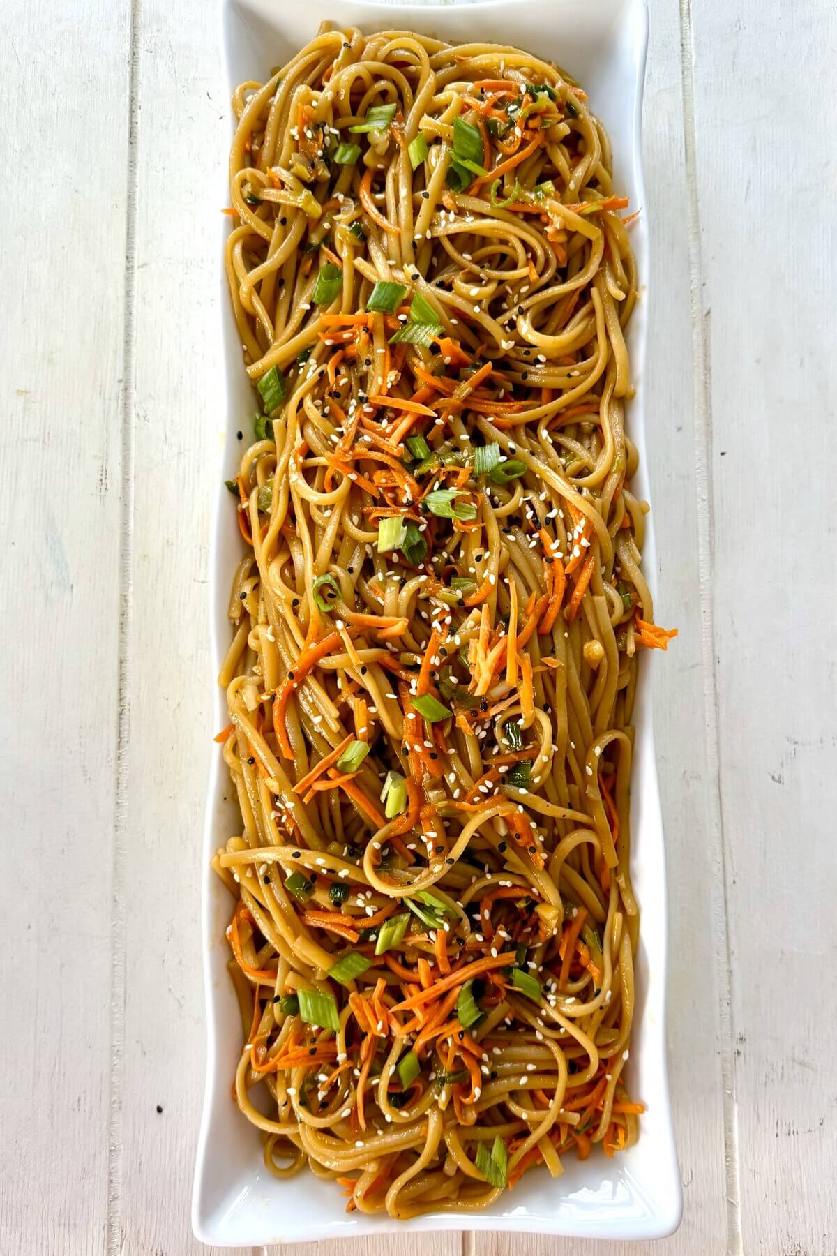 serving dish of garlic sesame noodles.