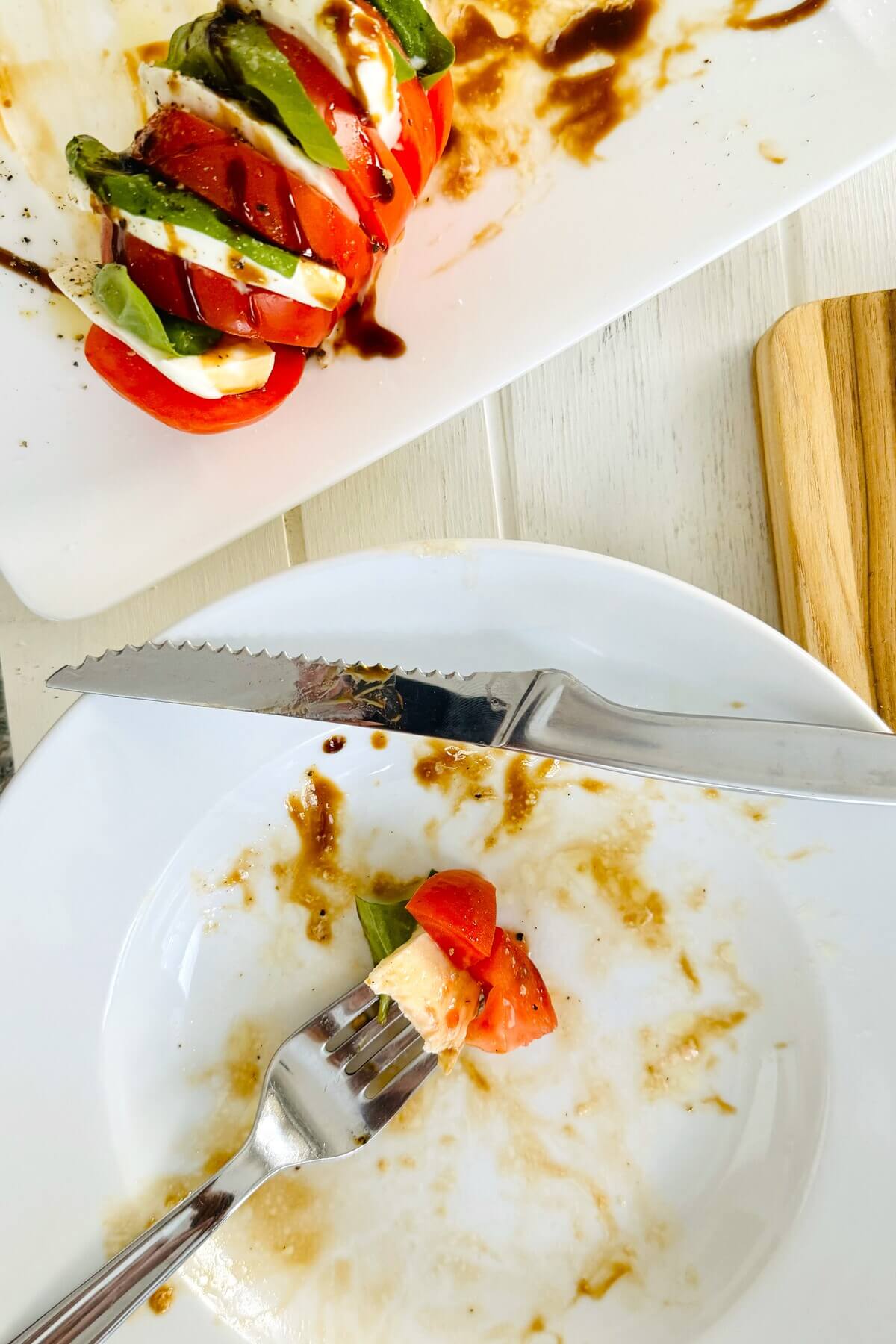 a bite of caprese salad on a fork.