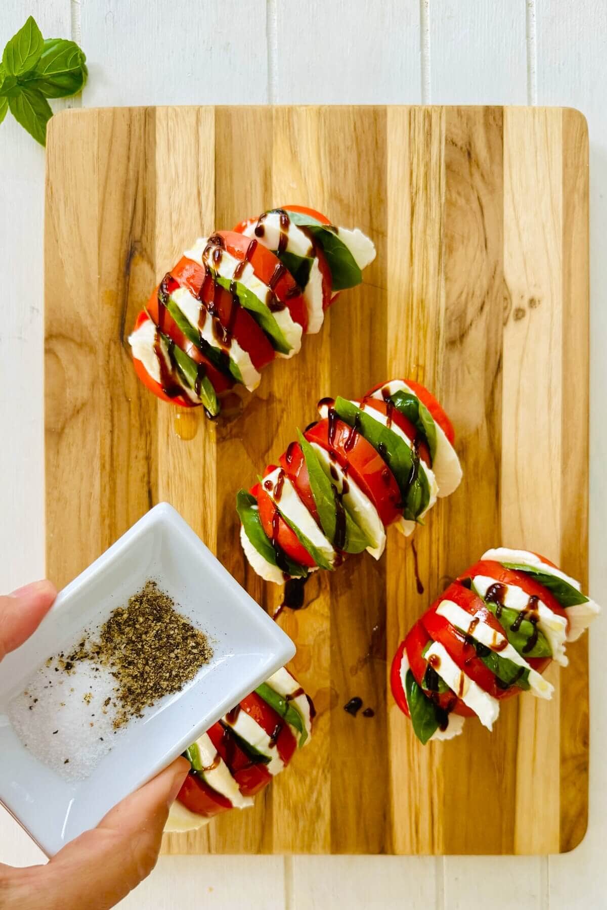 salt and pepper with caprese salad tomatoes.