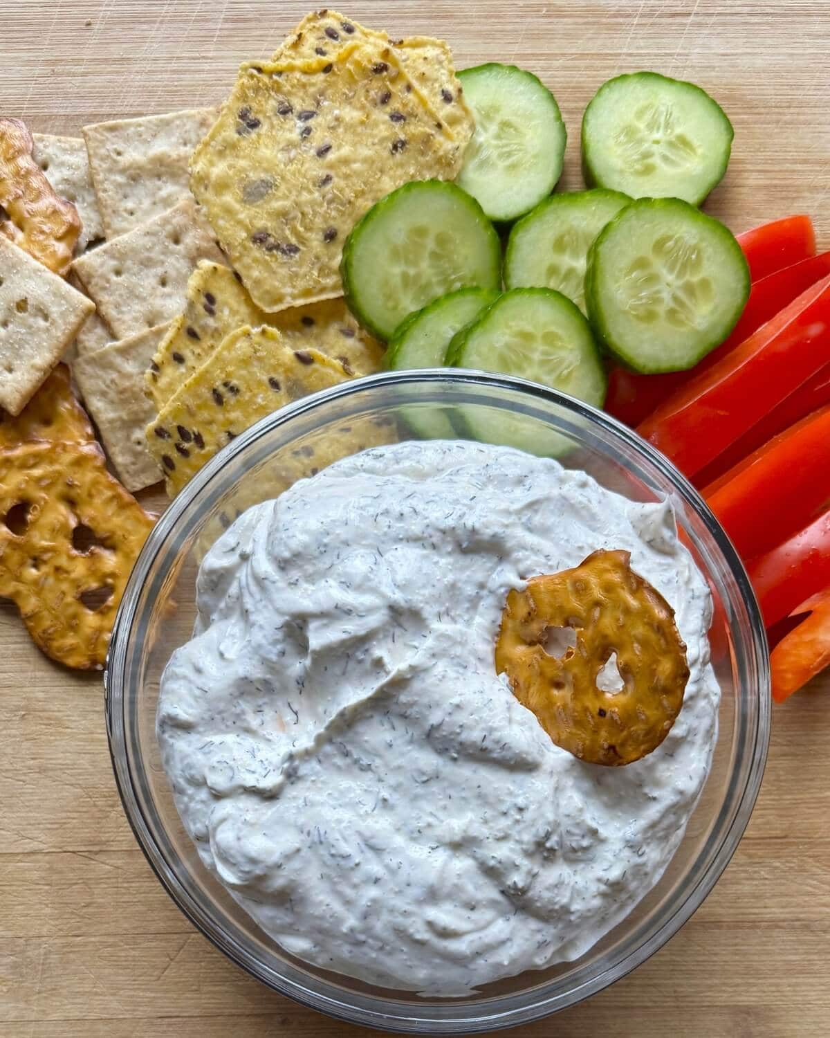 A pretzel in sour cream dip.