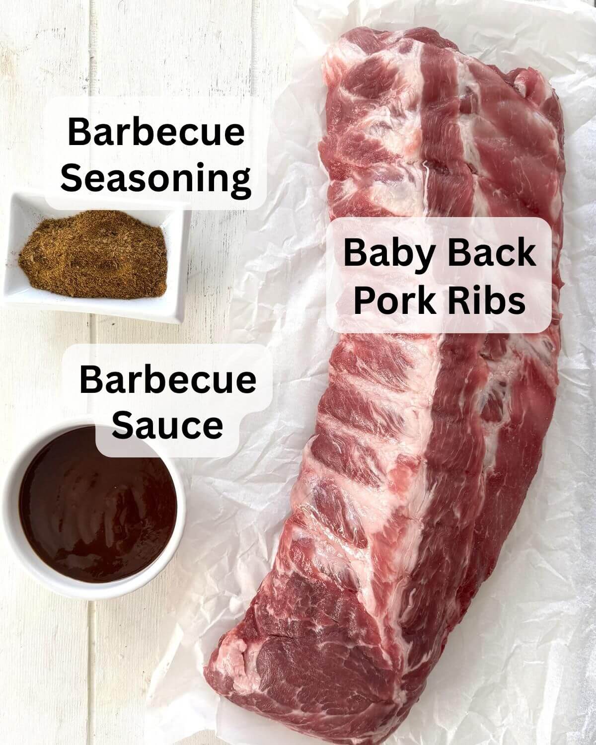 Rack of baby back ribs, barbecue sauce and seasoning.
