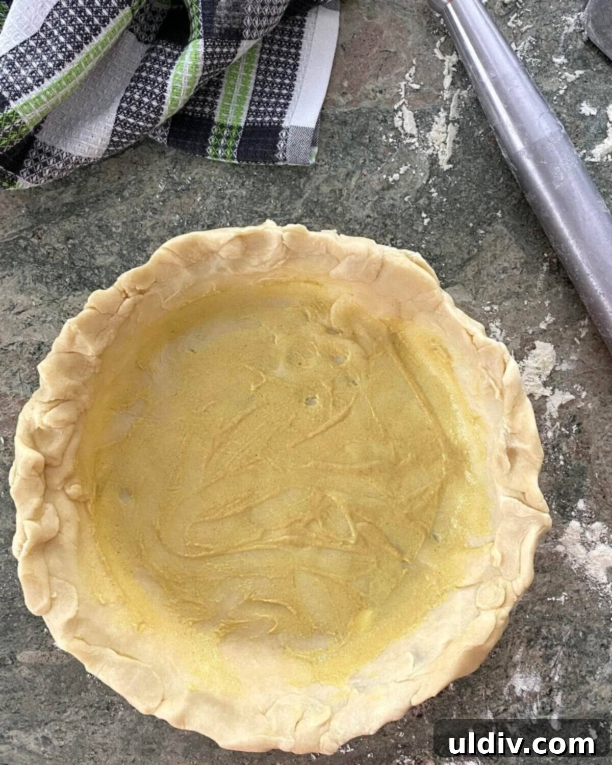 Savory Zucchini Herb Tart 4 unbaked pie crust brushed with mustard.