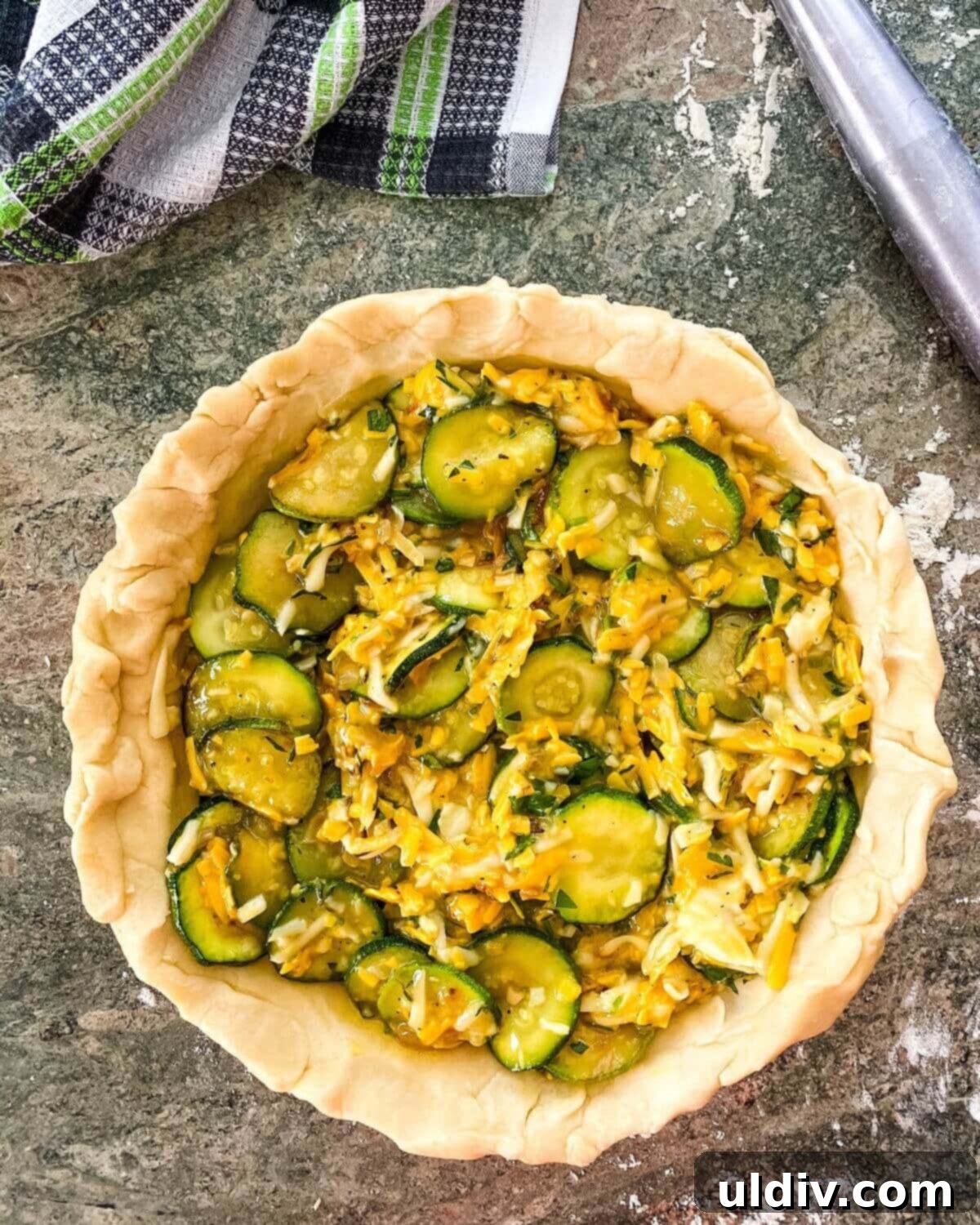 Herbed Zucchini Delight 6 The vibrant, unbaked filling of vegetables, cheeses, and eggs, perfectly combined in a pie crust, awaiting baking.