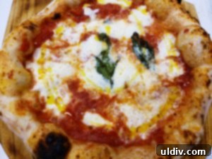 Closeup of a pizza slice, showcasing its vibrant ingredients