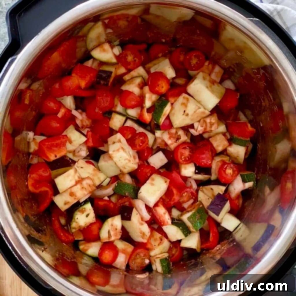 Effortless One-Pot Slow Cooker Ratatouille 5 Diced vegetables in an Instant Pot slow cooker liner.
