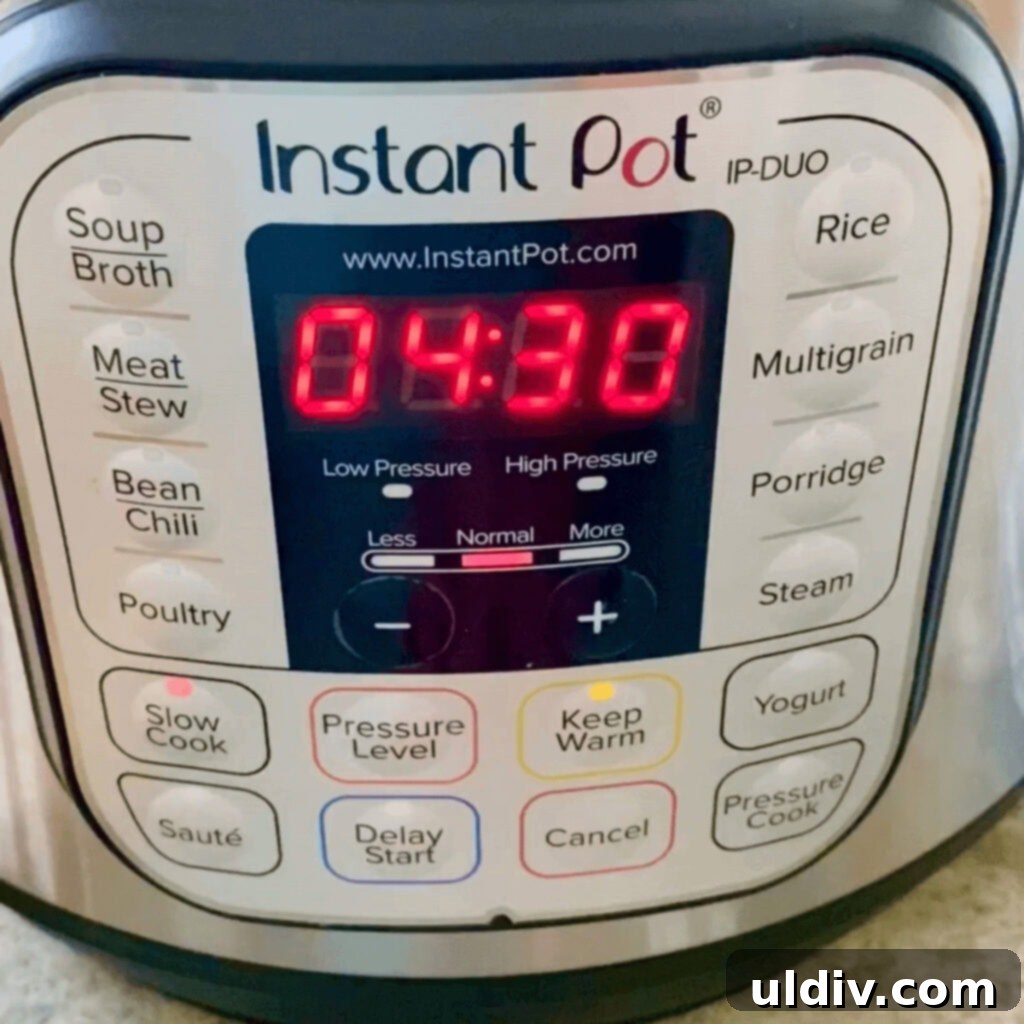 An Instant Pot set to the slow cooker setting for 4 hours and 30 minutes.