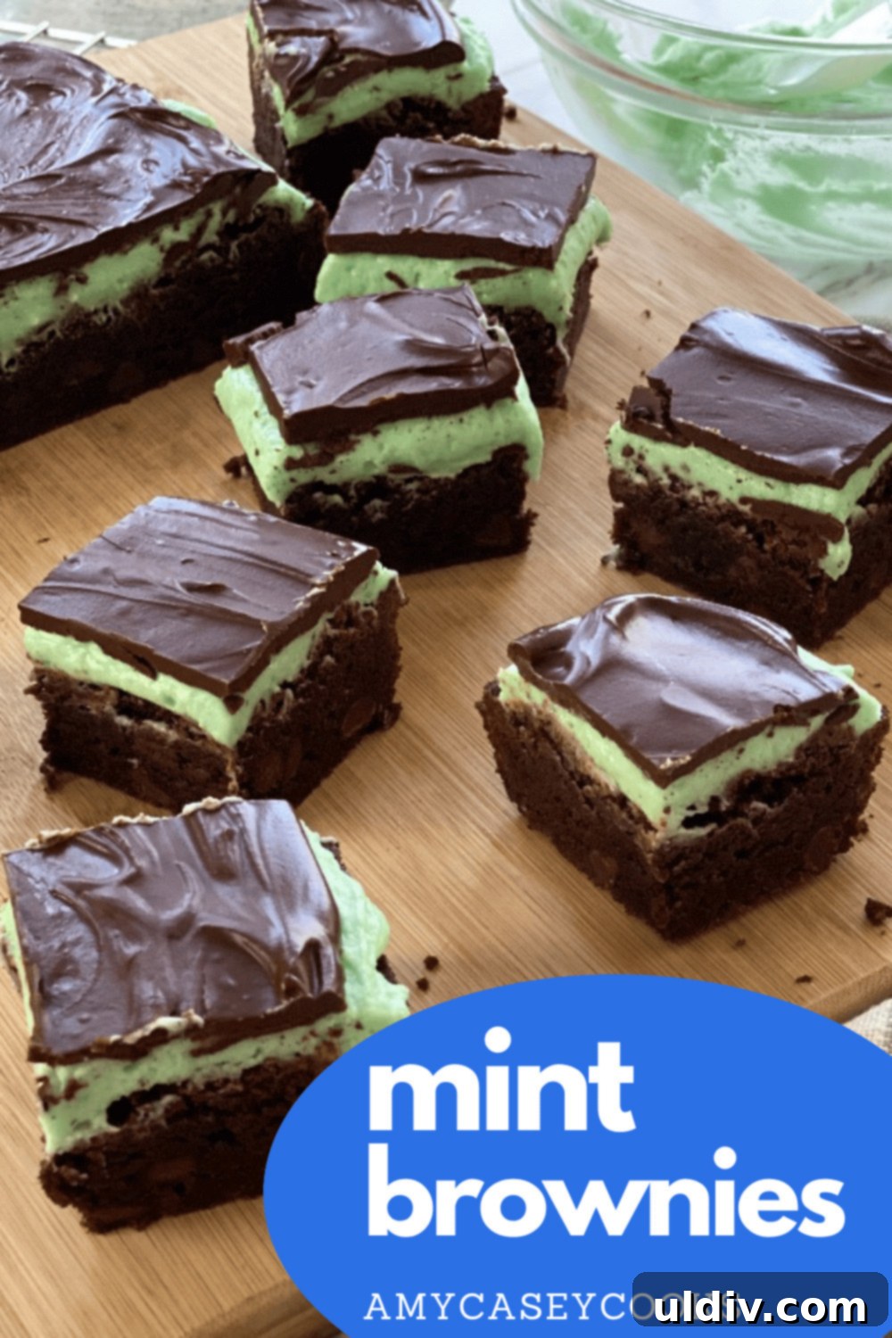 Sinfully Fudgy Mint Brownies 6 A close-up of a stack of fudge brownies featuring distinct layers of chocolate brownie, green mint buttercream, and dark chocolate ganache.