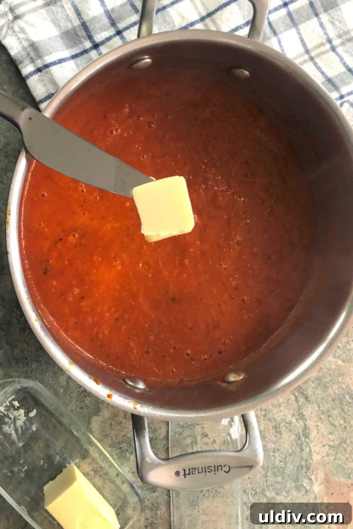 Basil-Kissed Tomato Bisque 8 Adding a pat of butter to tomato soup.