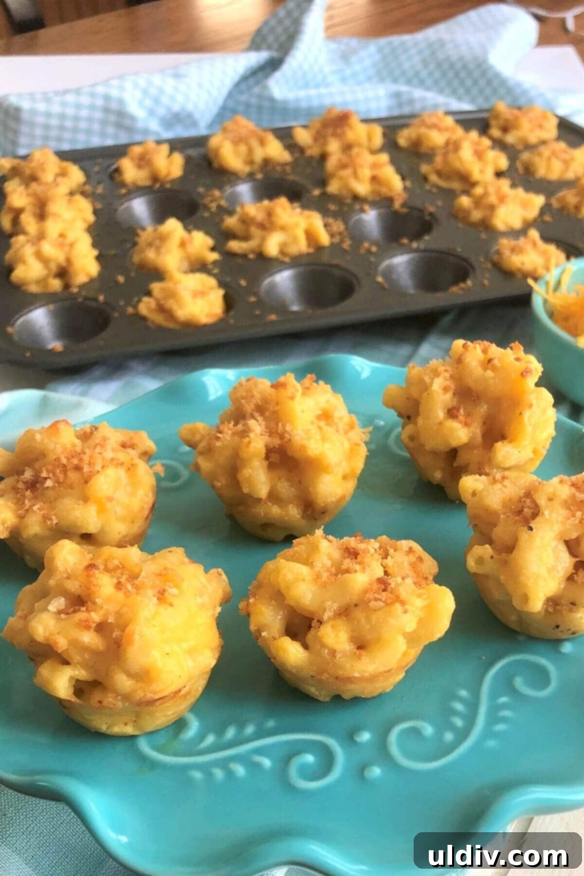 Crispy Mac & Cheese Bites: The Ultimate Kid & Party Treat 2 A vibrant teal plate showcasing perfectly golden, crispy macaroni and cheese bites, garnished for serving.