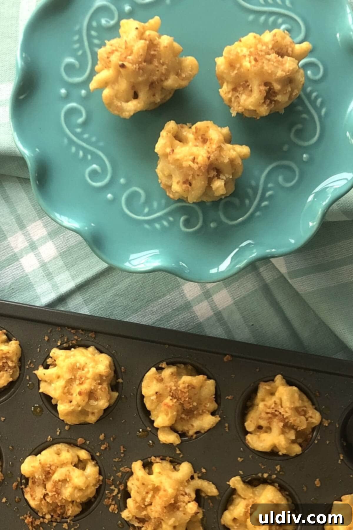 Party-Perfect Mac and Cheese Bites 12 mini muffin pan with macaroni and cheese cups.