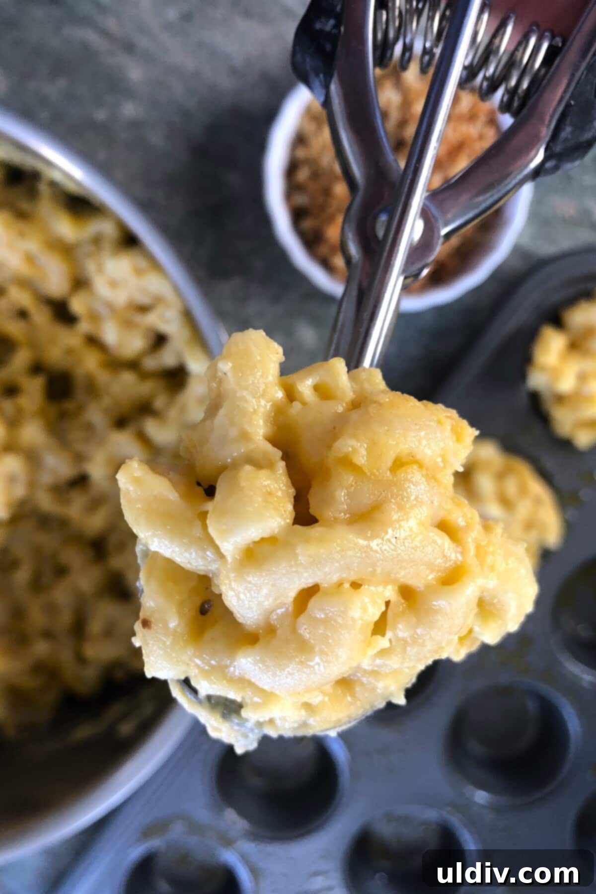 Party-Perfect Mac and Cheese Bites 8 a scoop of macaroni and cheese.