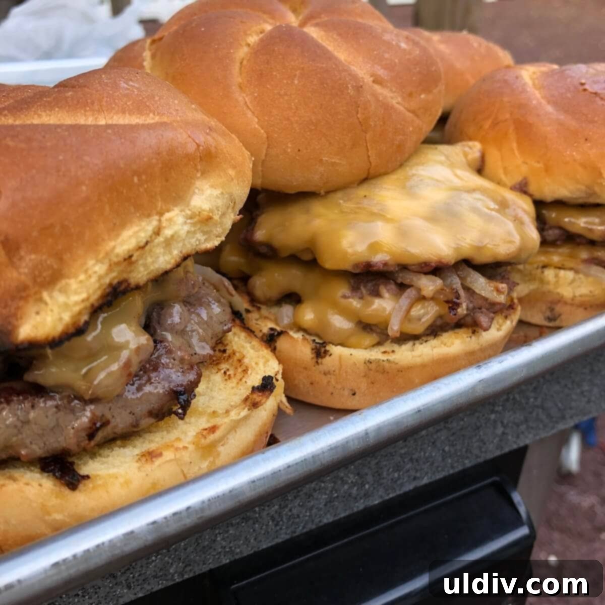 Smash Burger Perfection 2 A platter of perfectly cooked smash burgers with melted cheese and fresh toppings, ready to serve.