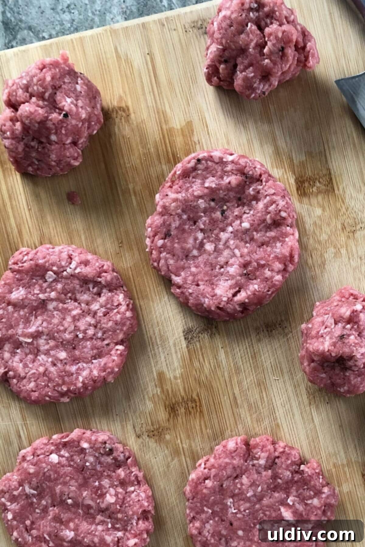 Smash Burger Perfection 3 Raw ground beef portions, perfectly balled and seasoned for the smash burger recipe.