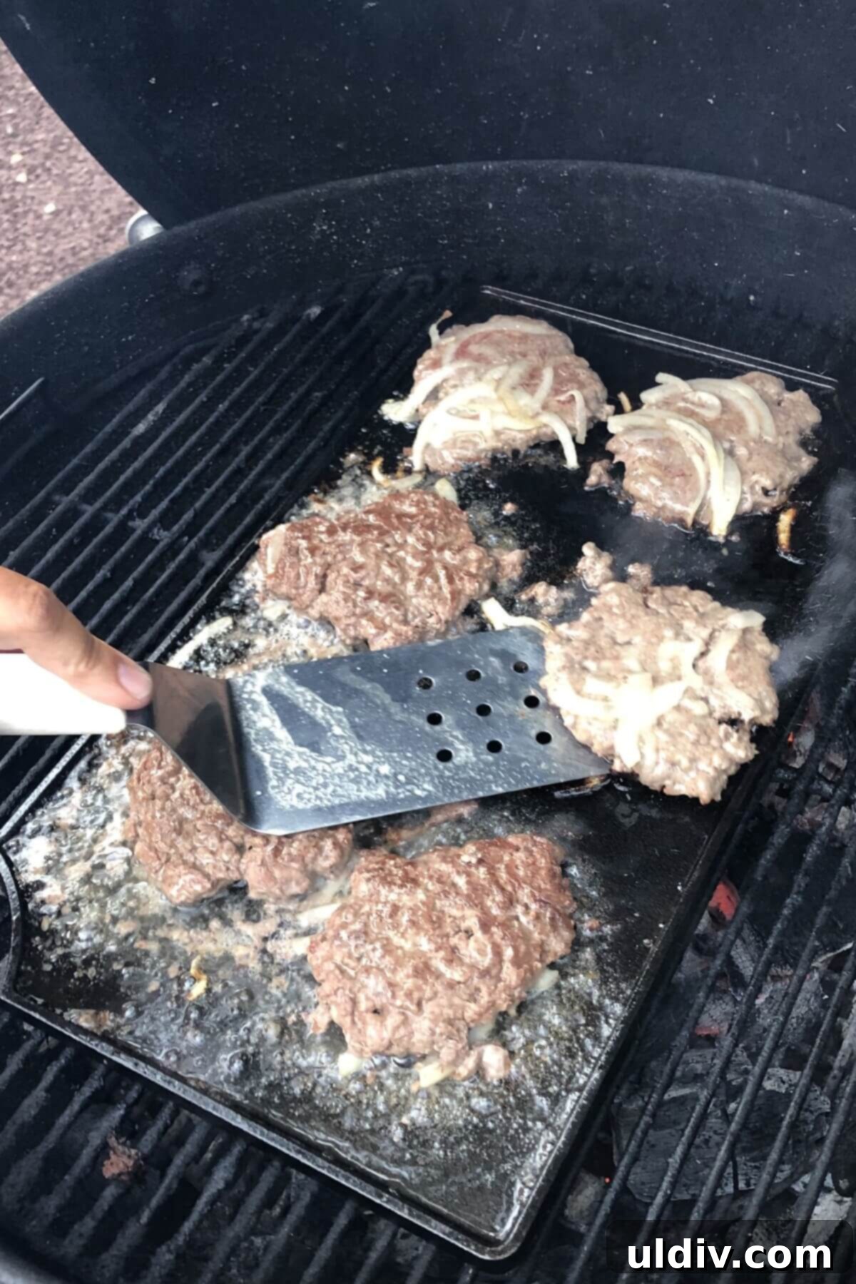 Smash Burger Perfection 5 Flipping smash burgers on the griddle, showing the crispy, caramelized underside.