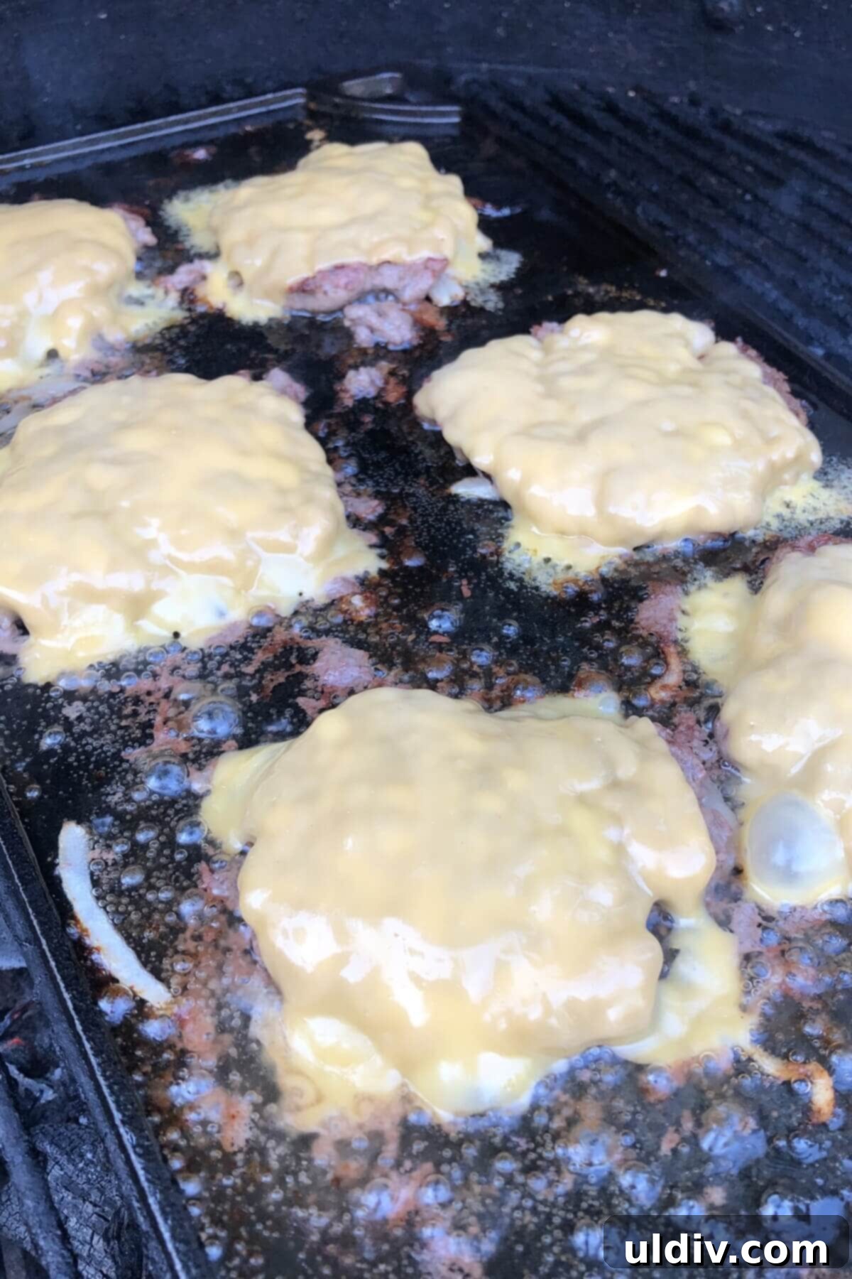 The Secret to Amazing Smash Burgers 6 Smash burgers on the griddle with perfectly melted American cheese.
