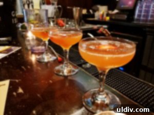 Artfully crafted cocktails with garnishes on a table