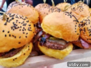 Gourmet prime burger topped with bacon, aioli, and white cheddar, served with fries
