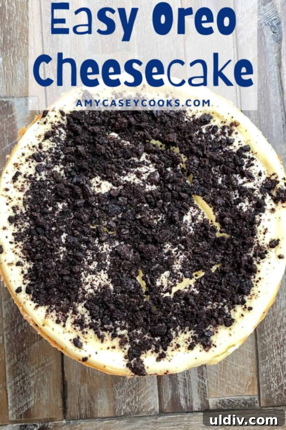 Effortless Oreo Cheesecake Recipe 15 A stunning whole Oreo cheesecake, perfectly baked and chilled, showcasing its rich dark crust and creamy white filling topped with cookie pieces.