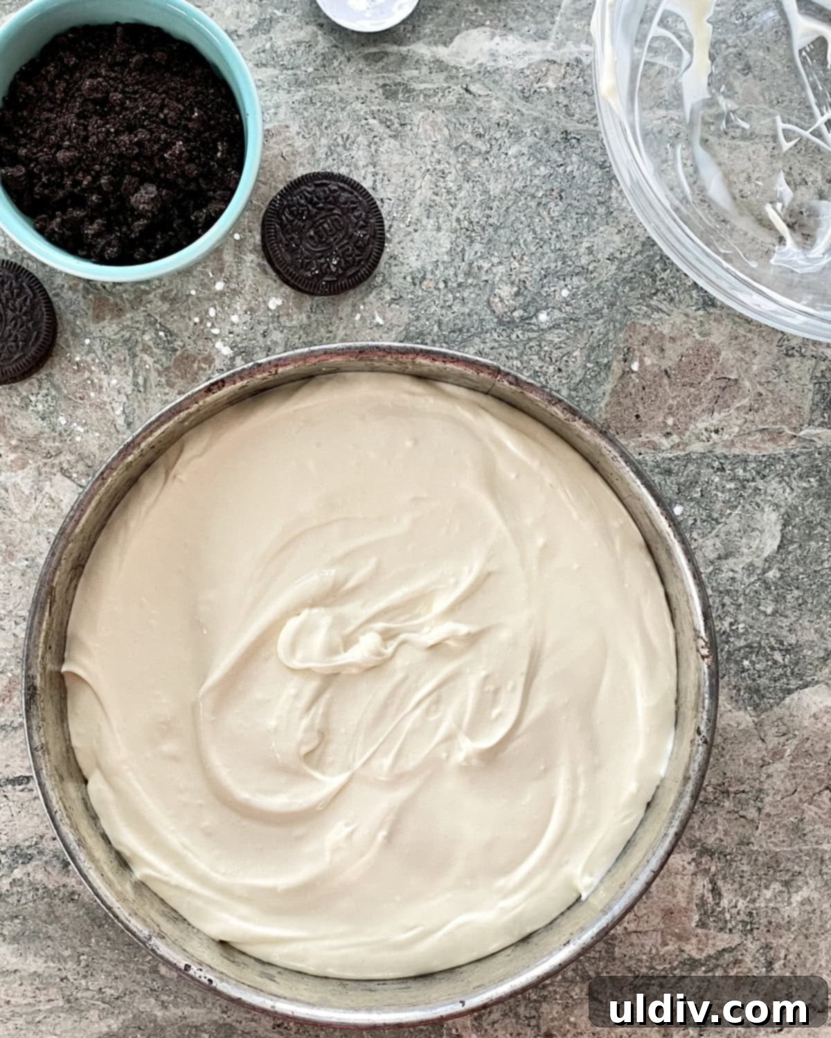 Quick and Easy Oreo Cheesecake 8 Smooth cheesecake batter spread evenly over the baked Oreo crust in a springform pan.